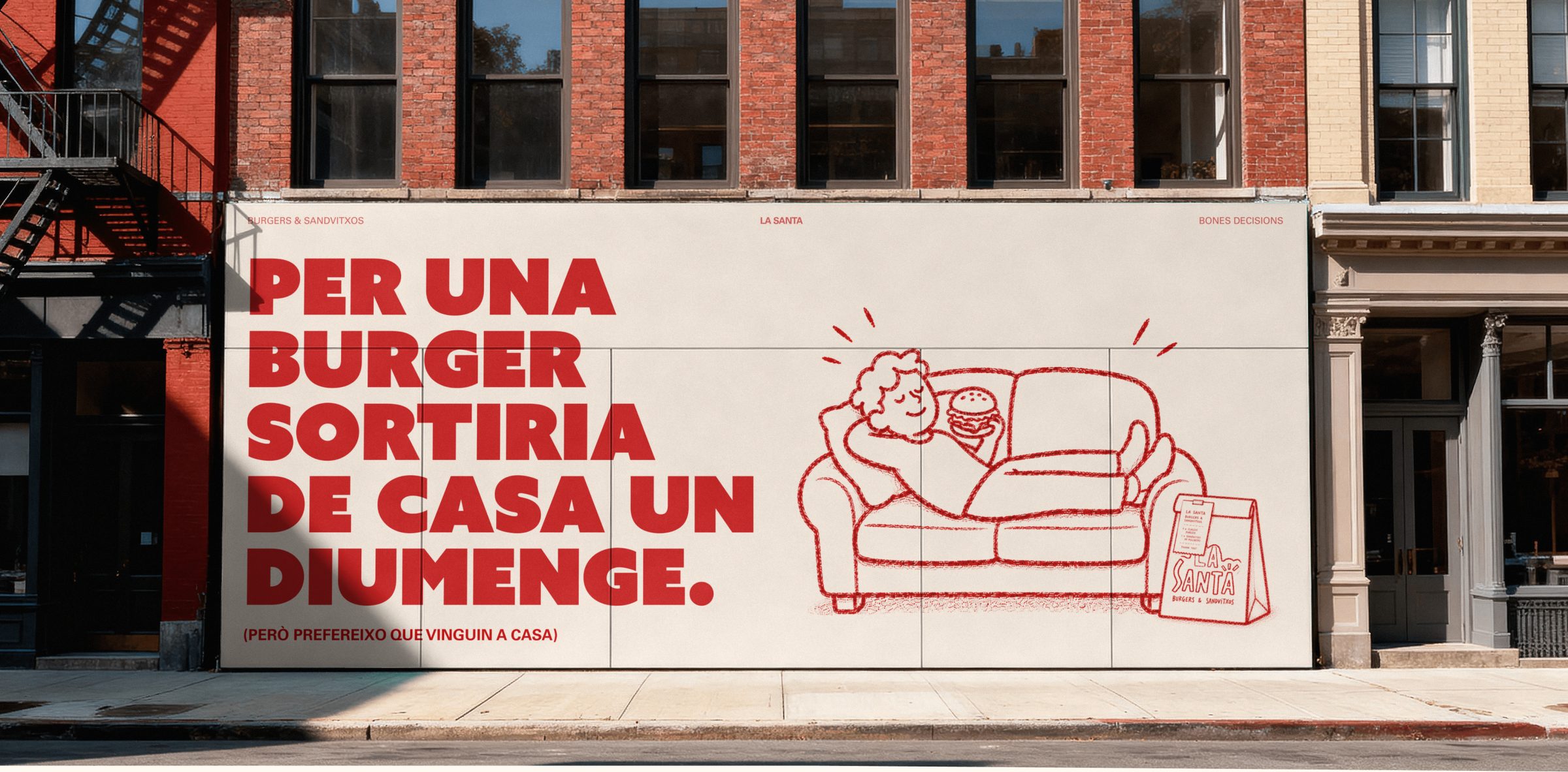 La Santa billboard on a city street: Per una burger sortira de casa un diumenge